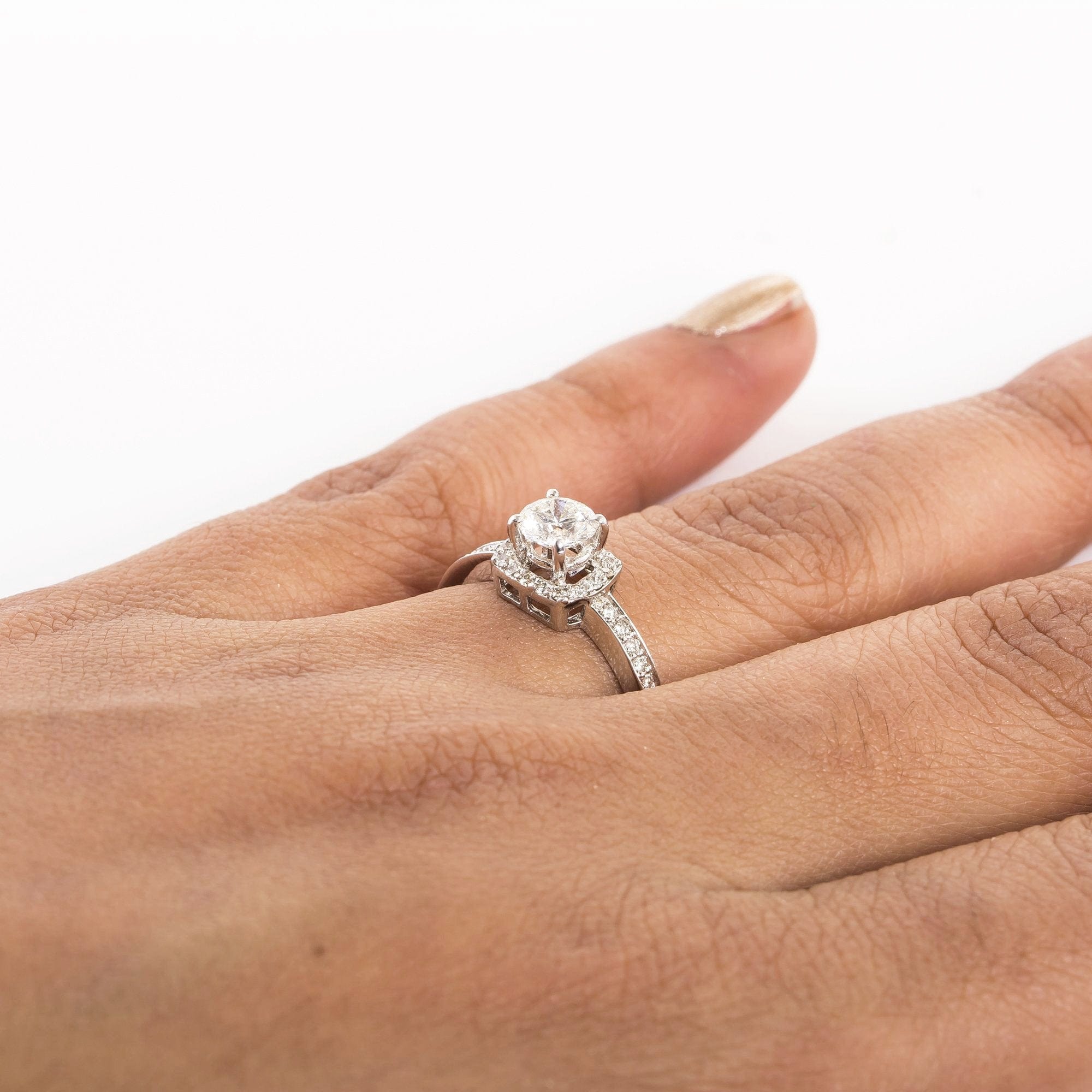 Beautiful Designer Platinum Solitaire Ring for Women with a raised solitaire. This photo depicts how the rings looks when worn in a finger of a deserving lady.