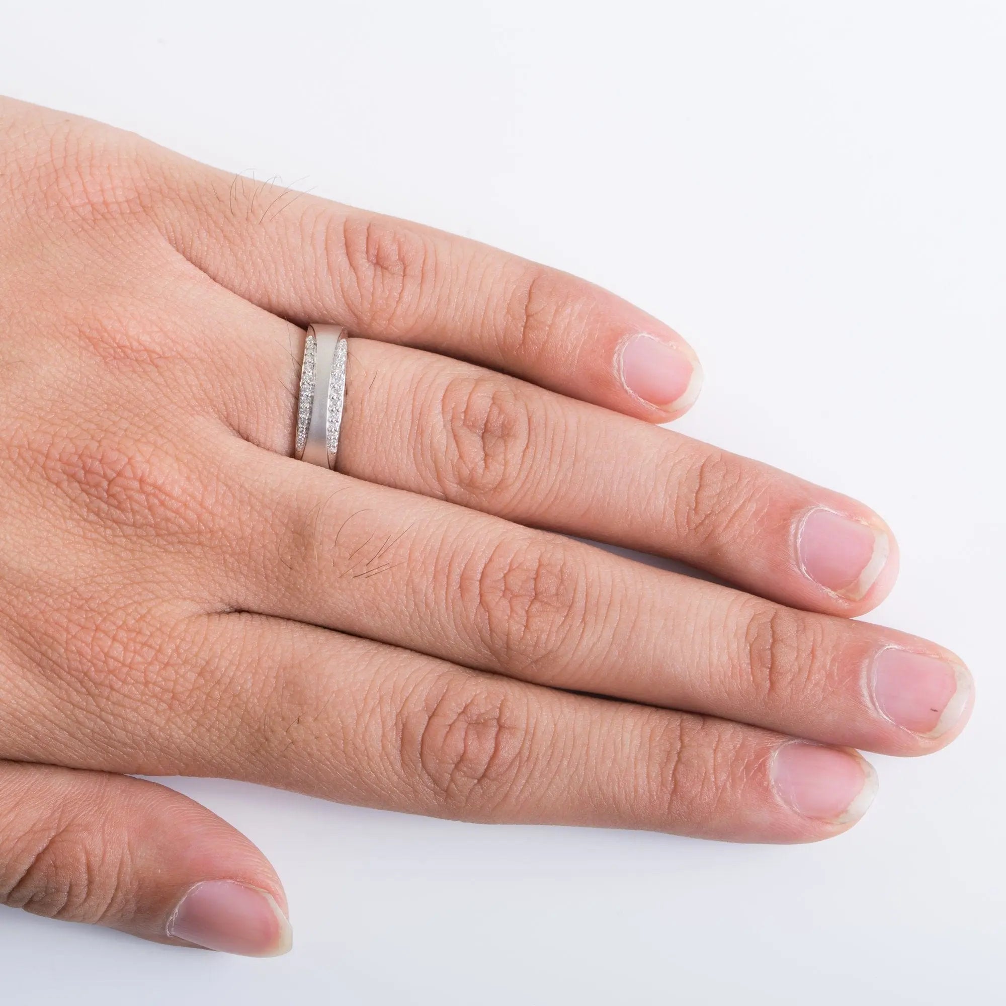 Finger Shot of Complementary Platinum Ring with Diamonds for Men SJ PTO 211. This photo shows how the platinum ring looks when worn by a man on his hand.