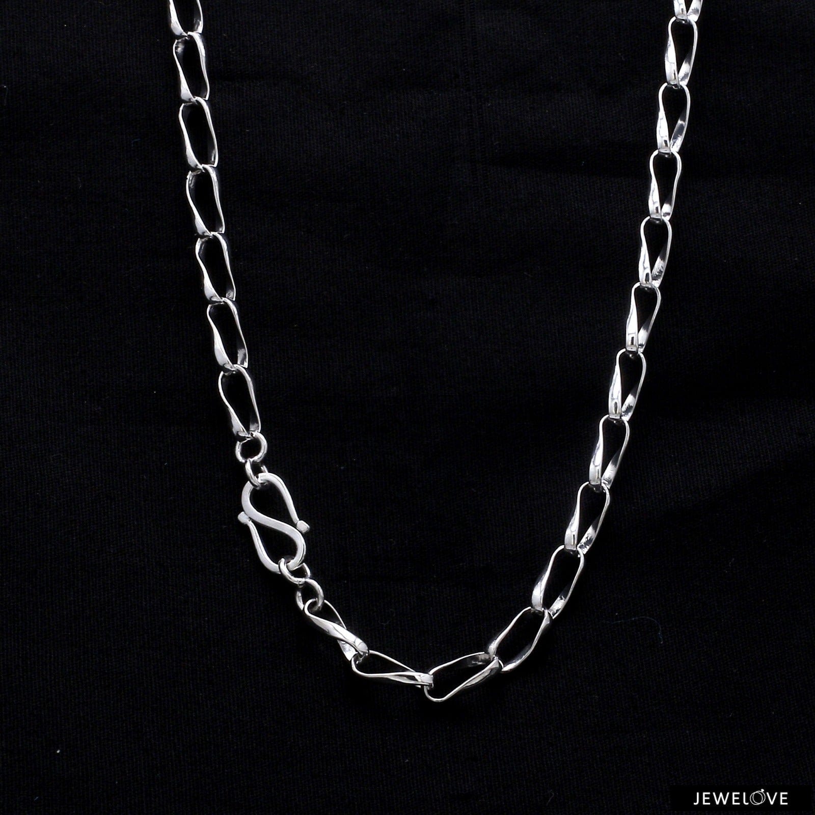 Curved link clearance chain